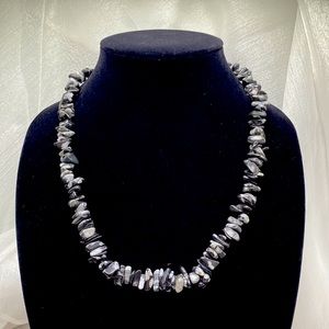 Gray and black gemstone chip necklace. This necklace is 36 in and eternity style
